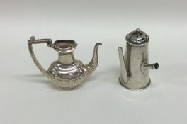 A miniature silver half fluted water jug together