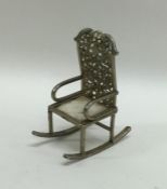 A novelty silver gilt model of a rocking chair. Ap