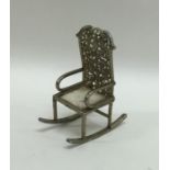 A novelty silver gilt model of a rocking chair. Ap