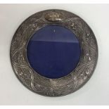 A stylish circular silver picture frame of texture