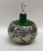 A stylish Chinese silver and green glass scent bot