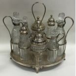 A large Georgian silver eight bottle cruet on stan