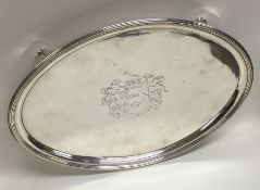 A heavy Georgian silver oval waiter with crested c