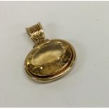 A huge 18 carat gold citrine single stone pendant