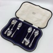 A boxed set of six rat tail silver teaspoons. Appr