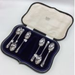 A boxed set of six rat tail silver teaspoons. Appr