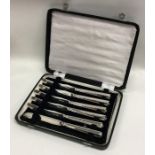 A boxed set of six silver bladed tea knives. Londo