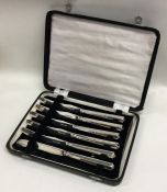 A boxed set of six silver bladed tea knives. Londo