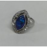 A black opal and diamond large cluster ring set in