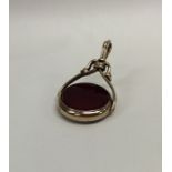 A blood stone set spinning fob with loop top. Appr