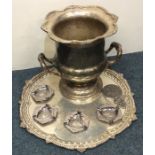 A silver plated campana shaped wine cooler togethe