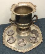A silver plated campana shaped wine cooler togethe