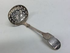 EXETER: A fiddle pattern silver sifter spoon. By J