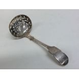 EXETER: A fiddle pattern silver sifter spoon. By J