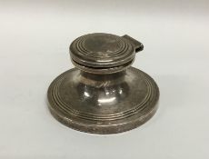 A silver hinged top inkwell with reeded decoration