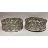 A good pair of Georgian silver wine coasters profu