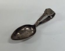 A Celtic silver caddy spoon of tapering form. Shef