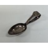 A Celtic silver caddy spoon of tapering form. Shef