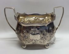 A good Georgian silver embossed sugar basket with