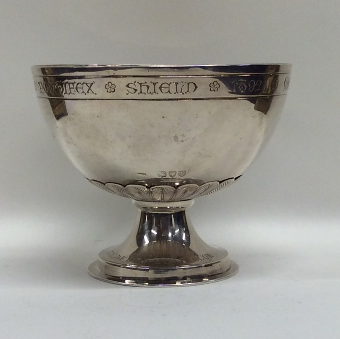 An Edwardian silver presentation bowl on spreading
