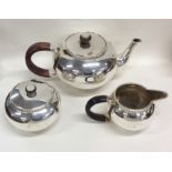 A stylish Sterling silver tea service with flush f