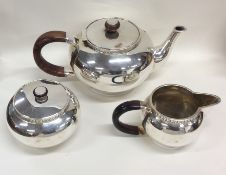 A stylish Sterling silver tea service with flush f