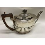 A good quality Edwardian silver half fluted teapot