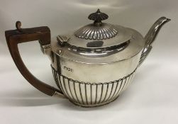 A good quality Edwardian silver half fluted teapot