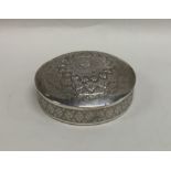 An Indian silver dome top box engraved with flower