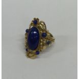 An unusual French lapis ring in 18 carat gold moun