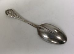 A fancy French silver tablespoon with scroll decor