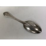 A fancy French silver tablespoon with scroll decor