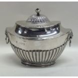An Edwardian silver half fluted boat shaped tea ca