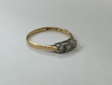 An 18 carat gold diamond three stone ring. Approx.