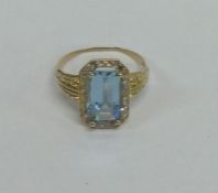 An Antique aquamarine and diamond cluster ring wit