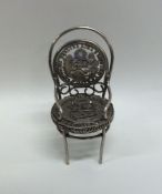 An unusual miniature silver dolls' house chair dec