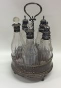 A Georgian silver five bottle cruet. London. Appro