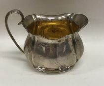 An Adams' style silver cream jug of tapering form