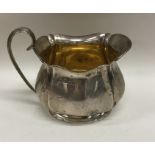 An Adams' style silver cream jug of tapering form