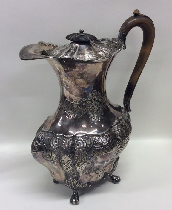 A heavy embossed silver water jug decorated with f - Image 2 of 2