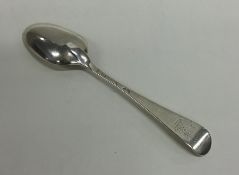 A Georgian silver Hanoverian pattern spoon with cr