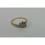 An Edwardian diamond three stone ring in gold and