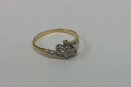 An Edwardian diamond three stone ring in gold and