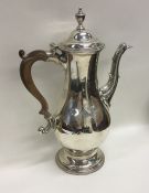 A Georgian silver coffee pot of baluster form and