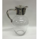 A good Victorian silver mounted hinged top water j