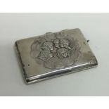 A silver hinged top purse decorated with cherubs.