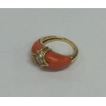 A stylish coral and diamond cocktail ring in gold