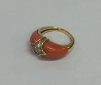 A stylish coral and diamond cocktail ring in gold