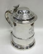 A good Georgian silver lidded tankard with taperin