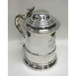 A good Georgian silver lidded tankard with taperin